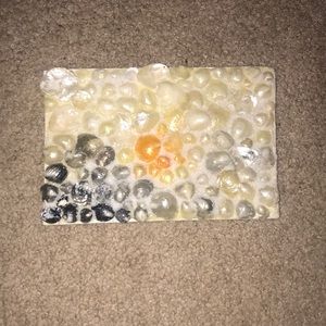 Beach art made with jingle shells